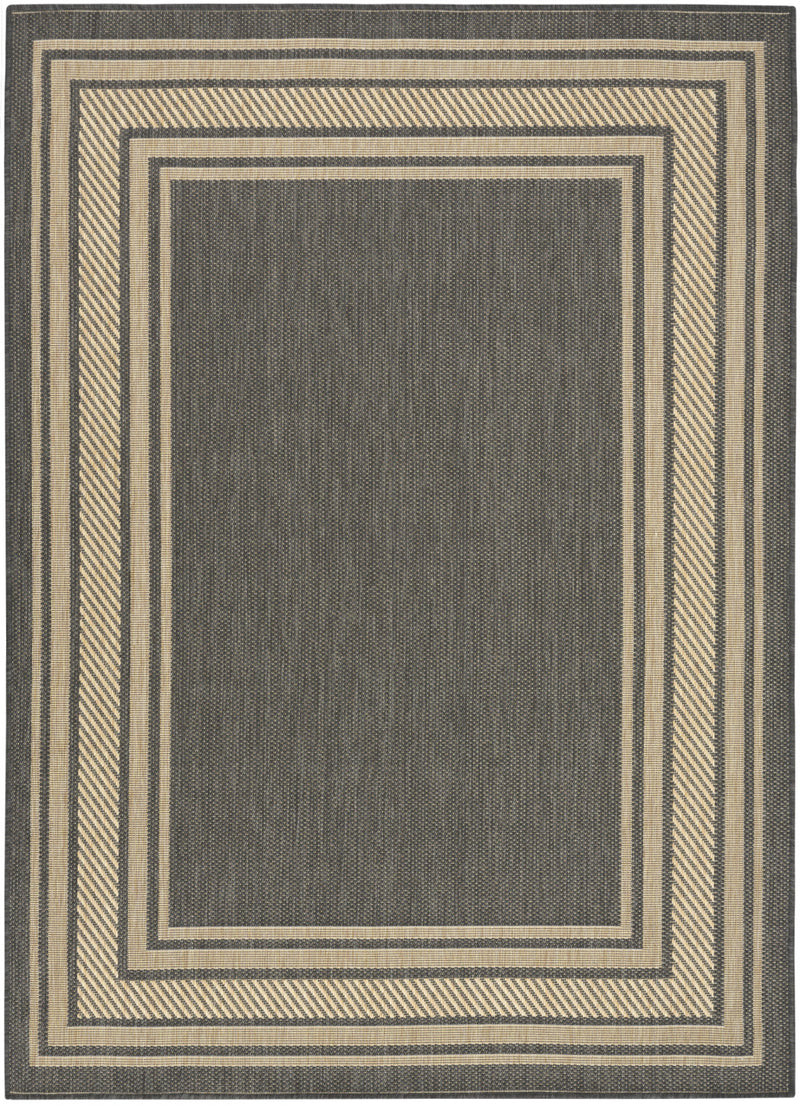 Charcoal geometric area rug with beige square border lines on a light background