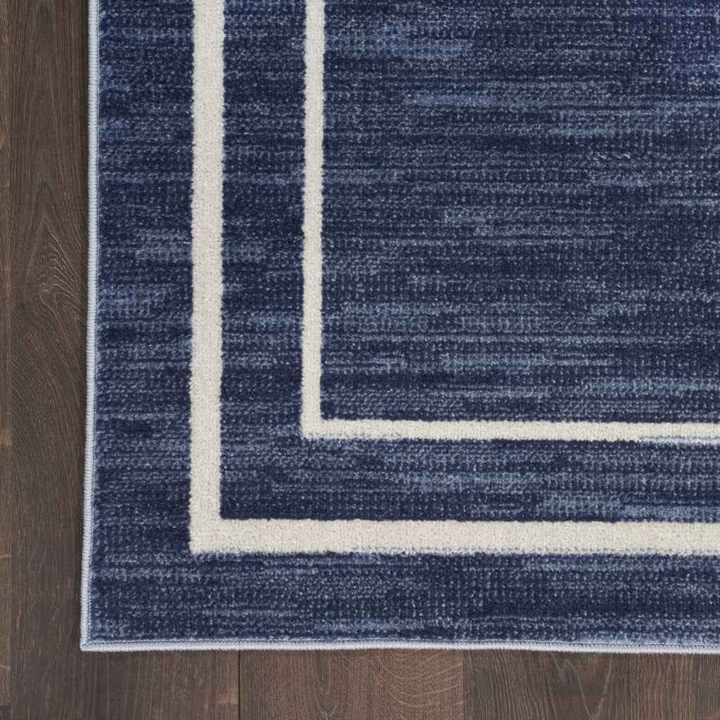 7' X 10' Navy Blue And Ivory Indoor Outdoor Area Rug