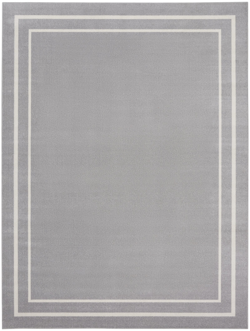 Indoor/outdoor area rug with grey center and layered ivory frame lines.