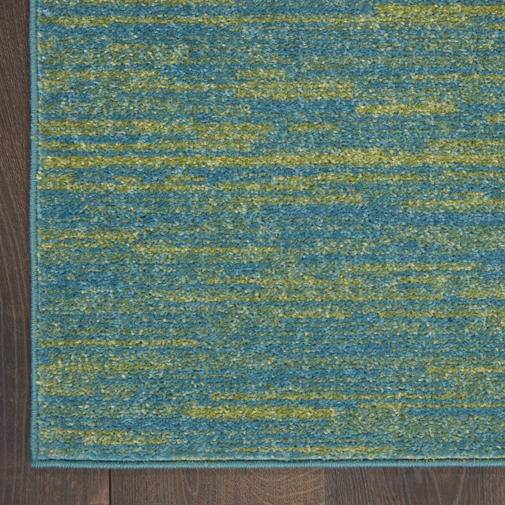 Blue and green abstract area rug, soft textured fabric, perfect for modern living rooms or bedrooms.