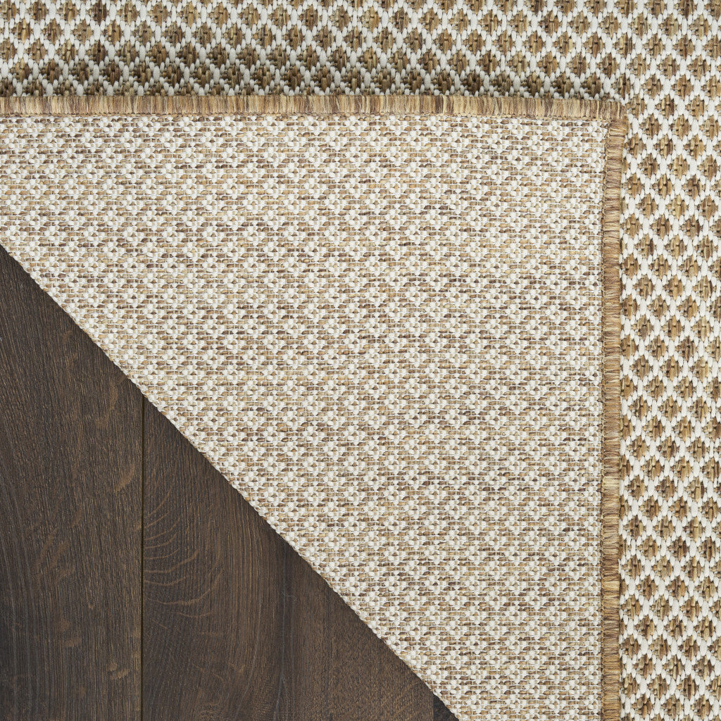 2 ft x 3 ft natural and ivory geometric area rug with fringed border