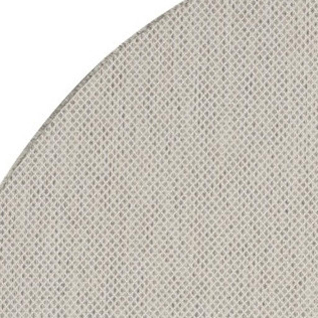 Close-up of rug pile and edge: ivory with silver-tone geometric lattice