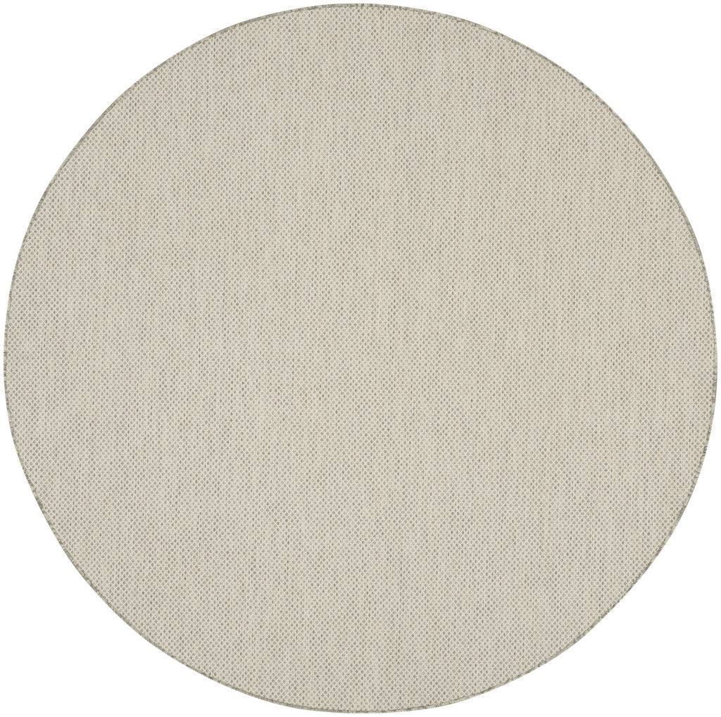 72-inch round ivory rug with silver-tone geometric lattice pattern, flat woven