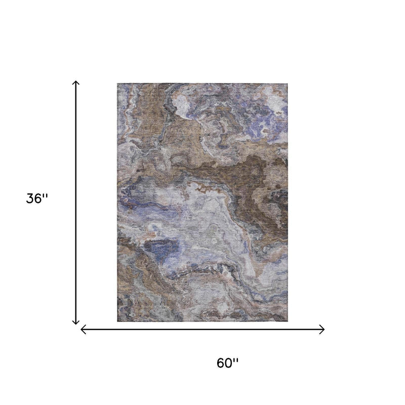 Abstract area rug with blue-gray mottled pattern, 60 x 36 in shown