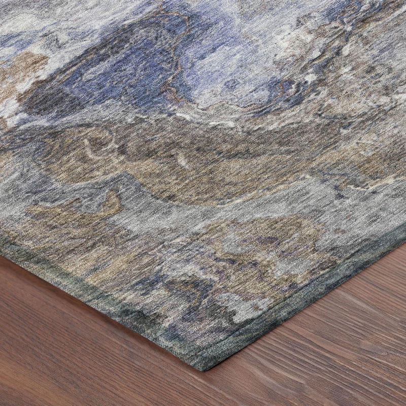 Abstract area rug corner with blue and gray marbled mottling