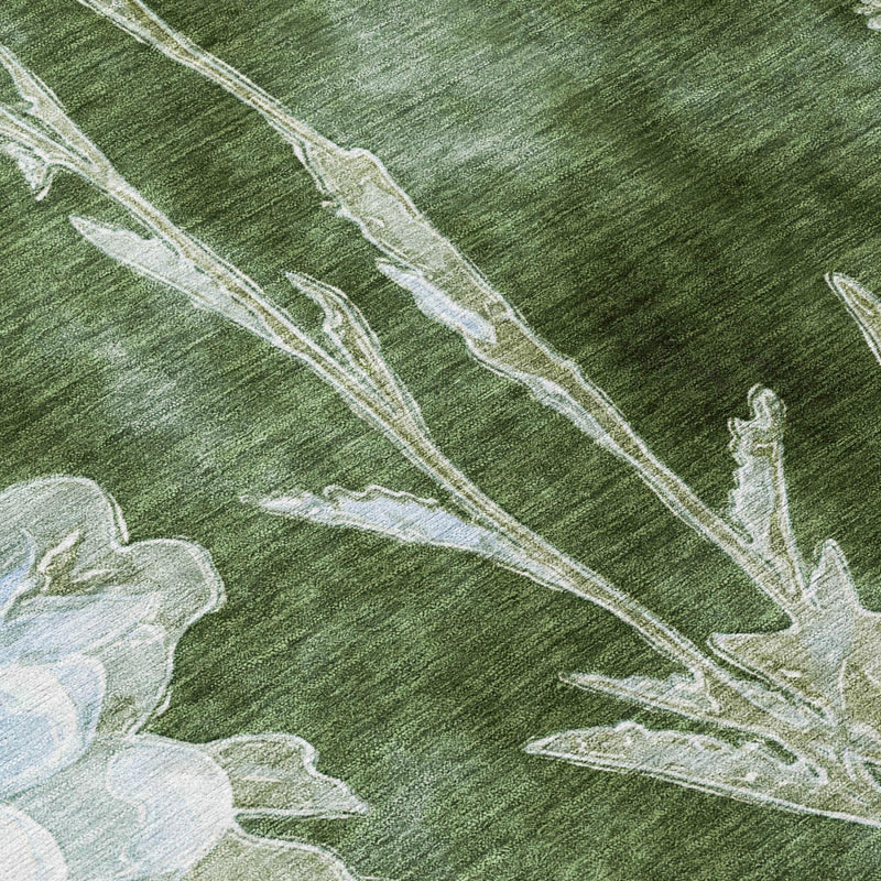 Green rug detail with ivory botanical stems and soft blue flower accents