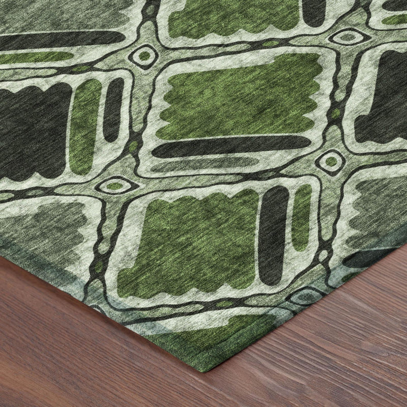 Geometric area rug corner view with green and gray abstract blocks