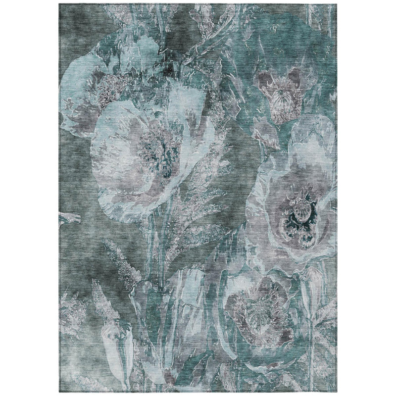 Abstract floral area rug in teal blue and graphite with distressed light accents