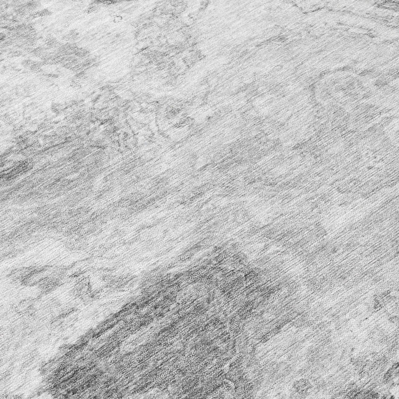 Gray and silver abstract area rug, close-up of mottled marbled texture