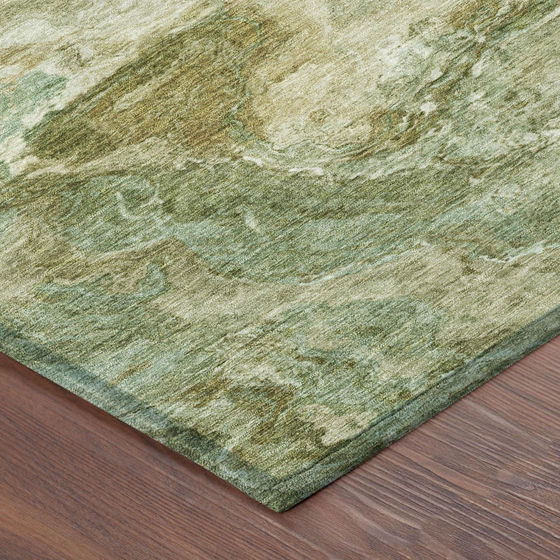 Rug corner with textured woven look, faded green, cream, and tan abstract pattern