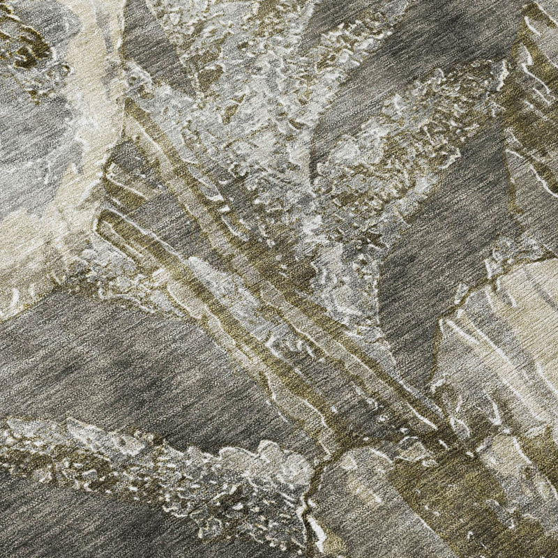 Textured close-up of pewter and gray rug with distressed cream floral pattern