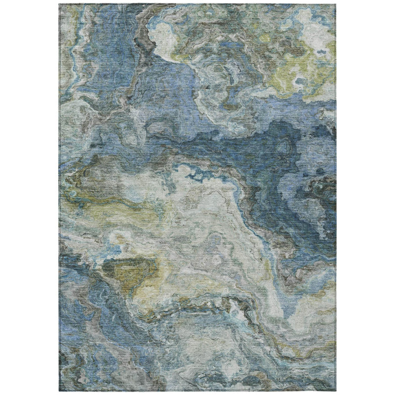 Rectangular blue abstract area rug with muted green and gray mottled pattern