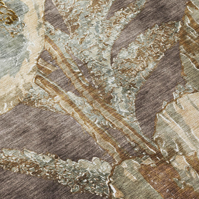 Close-up distressed floral area rug in brown, beige and light blue with textured weave