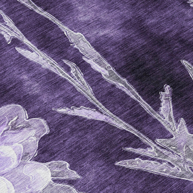 Eggplant purple area rug close-up with white and lavender floral stems and blossoms
