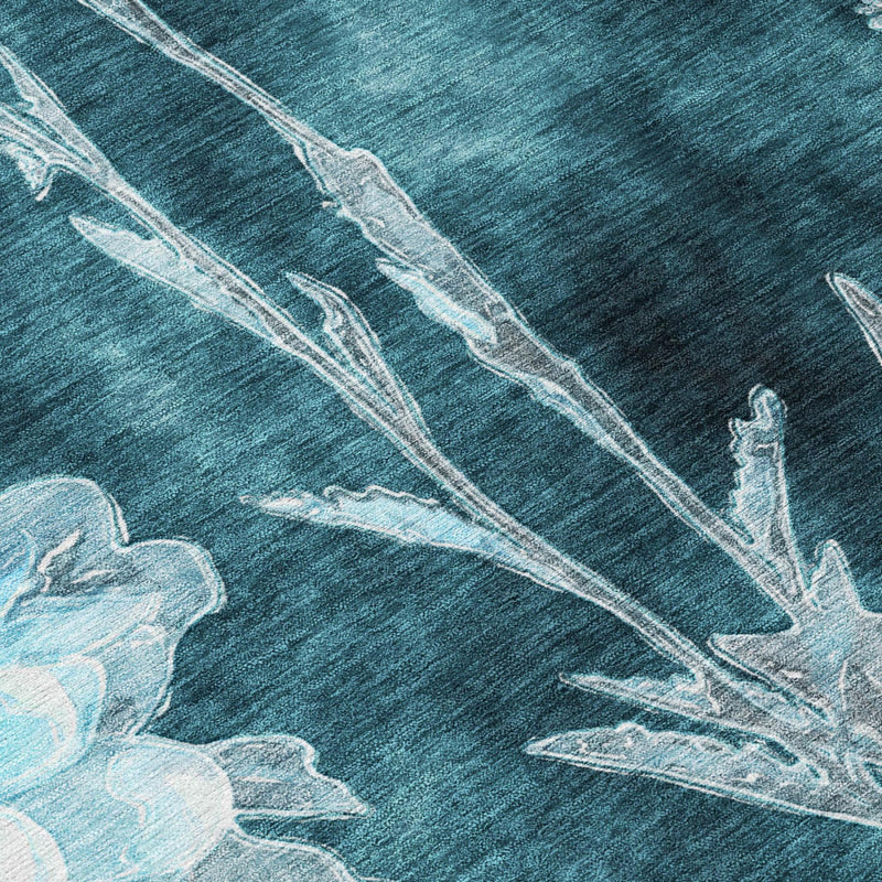 Close-up floral area rug, dark teal with pale blue stems and blossoms