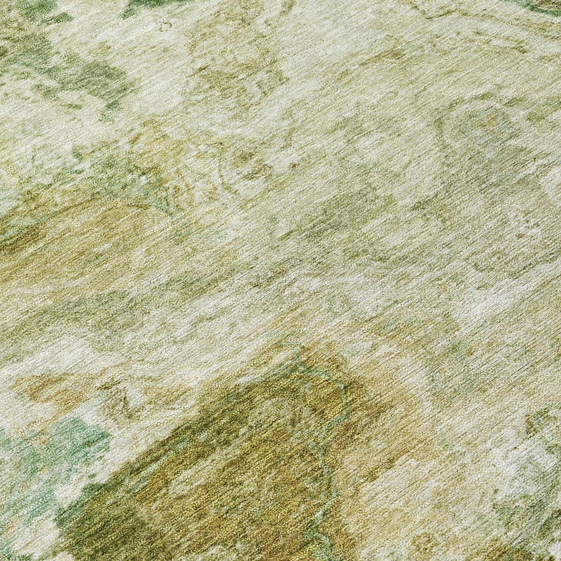 Close-up of green and tan distressed abstract area rug texture