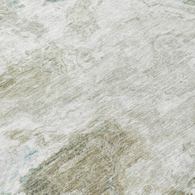 Abstract area rug texture in light beige with subtle muted teal streaks