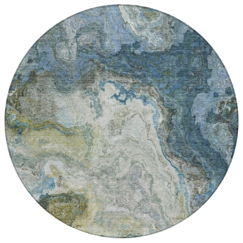 Round area rug with blue and green abstract map-style pattern and light center