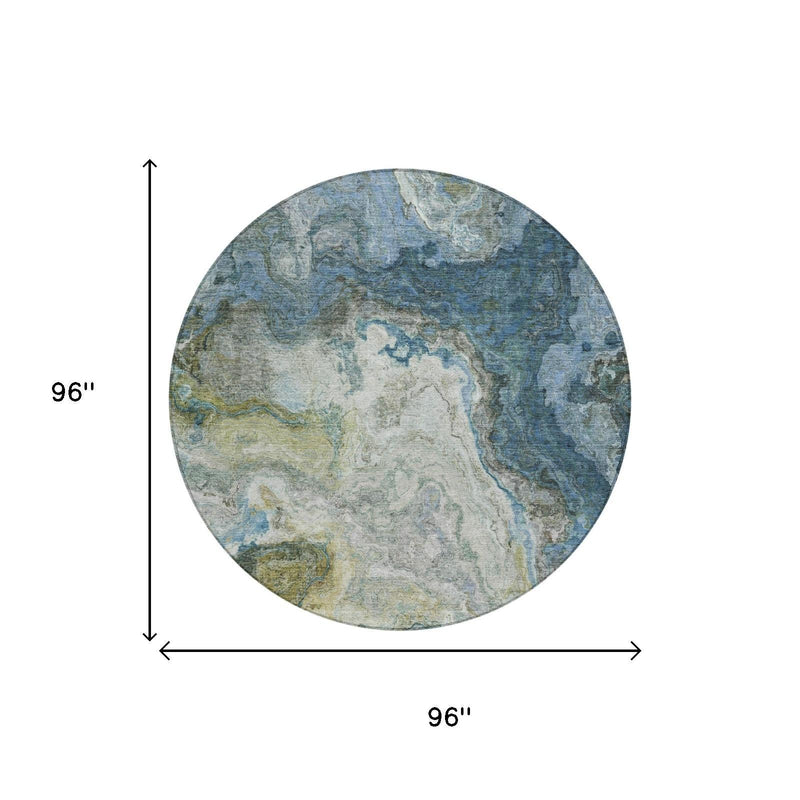 8 ft round area rug; abstract blue and gray washed design with size marking