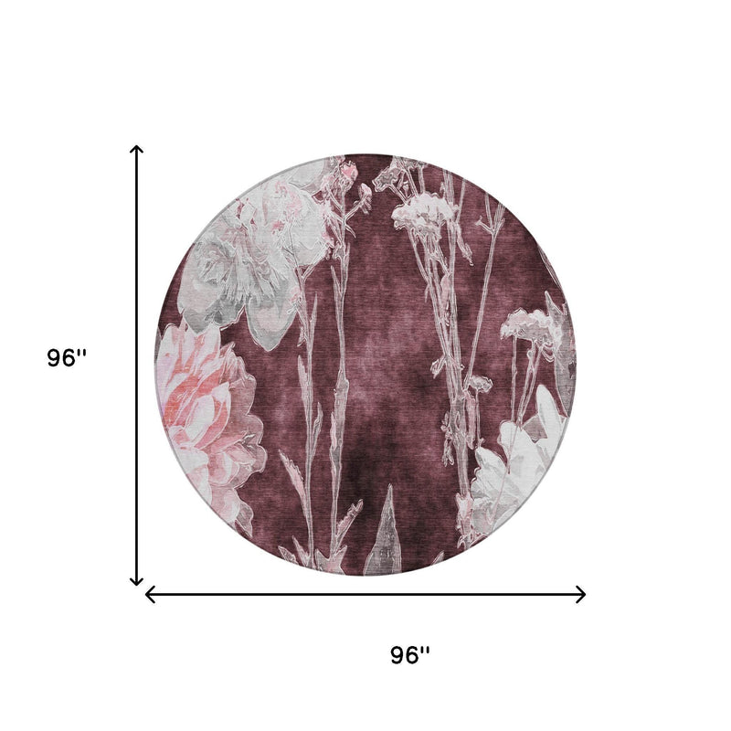 Round burgundy rug with white floral stems shown with 96-inch diameter