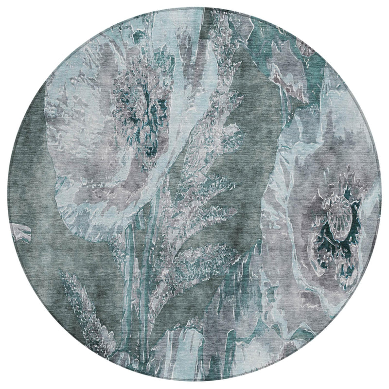 Round teal and graphite abstract floral rug with distressed vine-like motifs