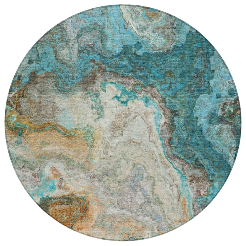 Round abstract area rug with aqua and teal map-like design and tan beige areas