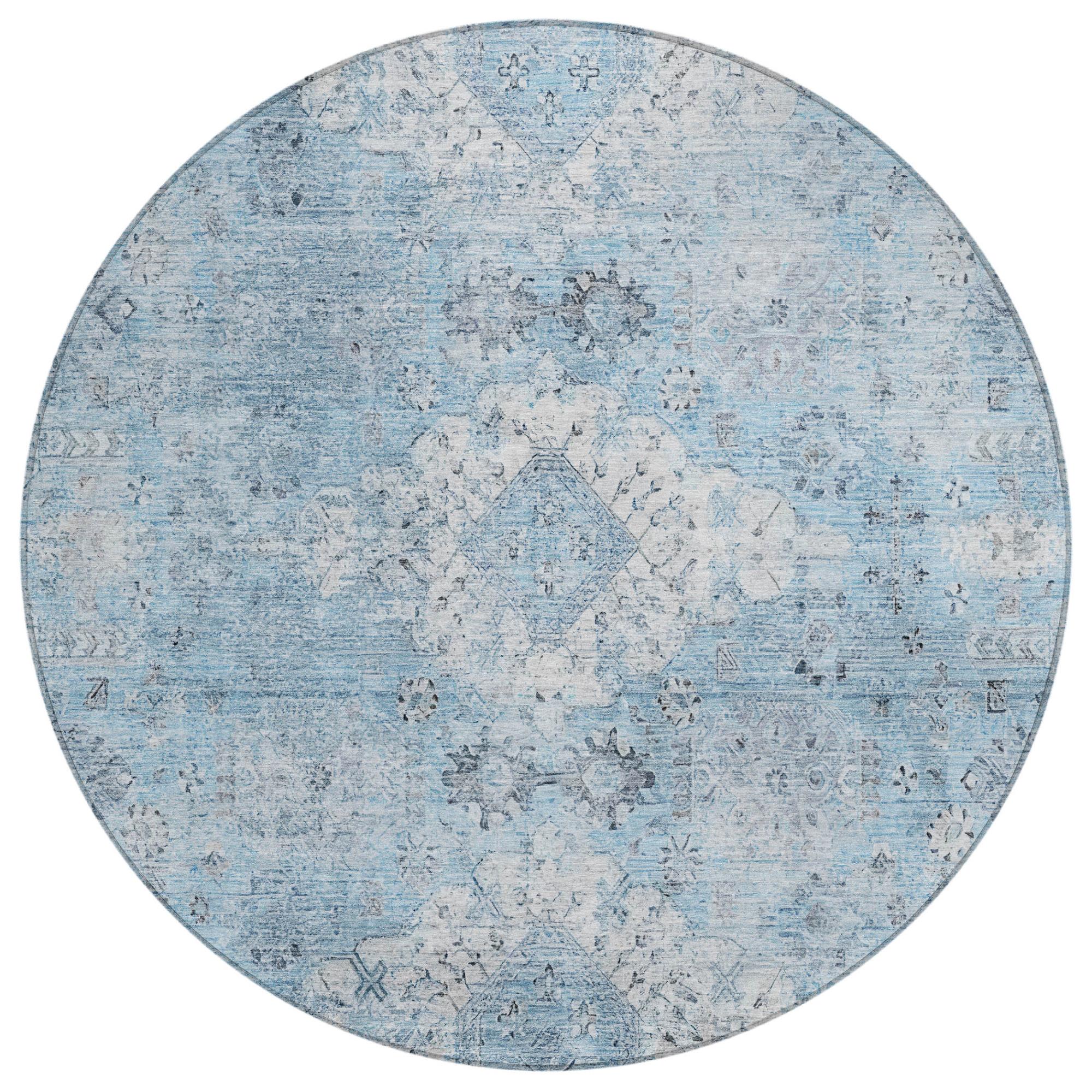 Round blue vintage-style area rug with intricate grey patterns, perfect for enhancing modern home decor.