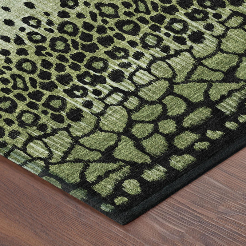 Close-up corner of green-and-black animal-print area rug with dark border