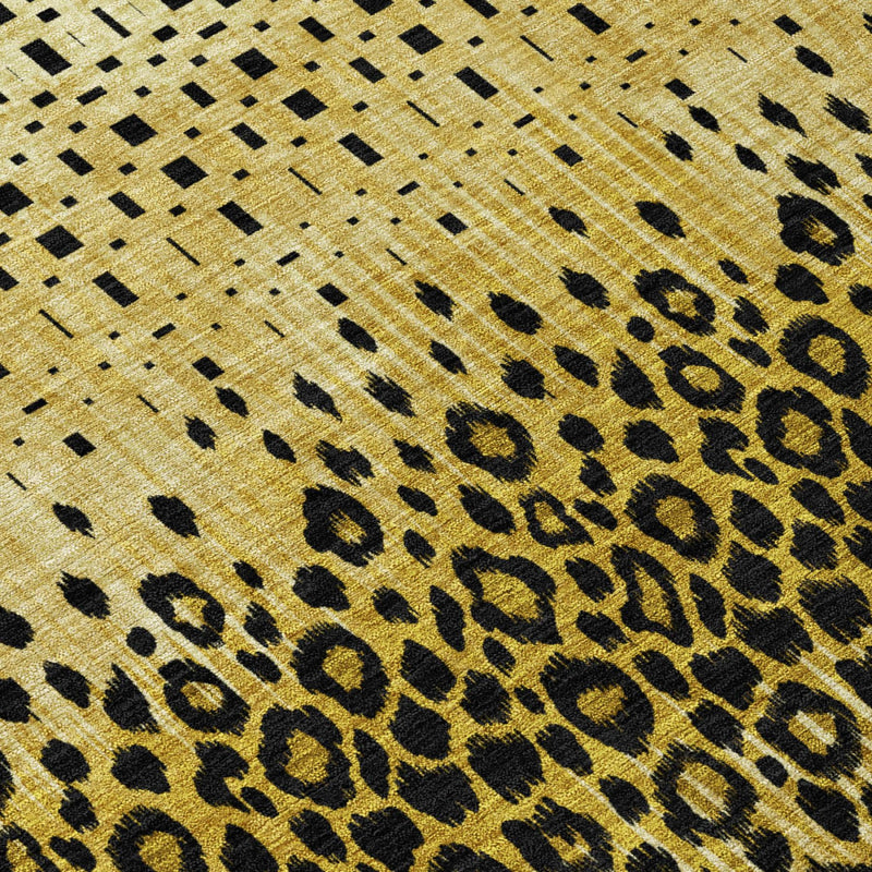 Gold rug close-up with dark leopard spots and dotted geometric lines