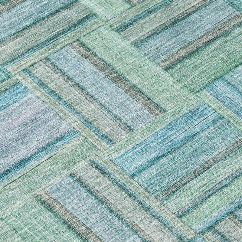 Teal and aqua striped block pattern area rug close-up