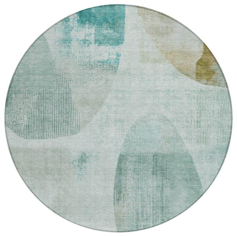 Round teal blue and silver-toned abstract geometric indoor outdoor area rug, top view.