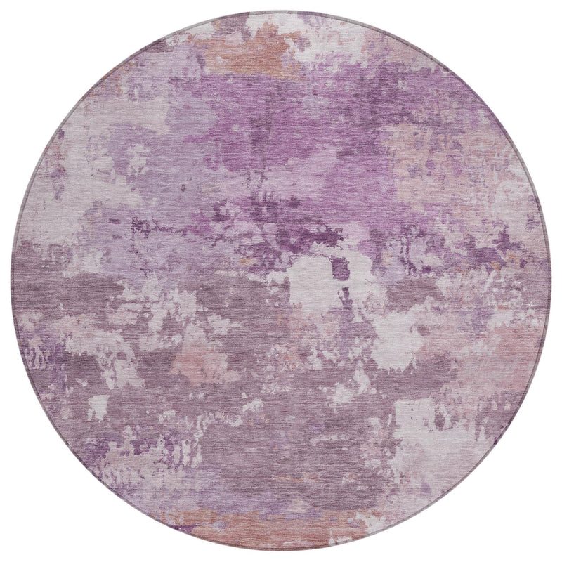 Round abstract area rug featuring purple plum distressed mottled pattern on light base