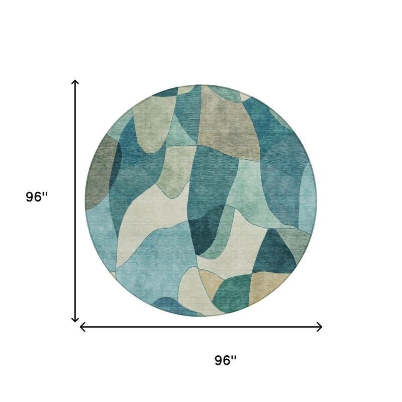 Round abstract area rug, 96 in diameter; teal, blue, and beige shapes