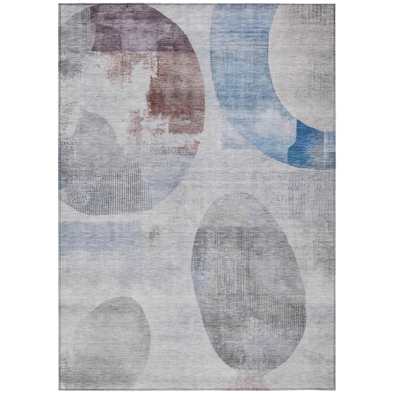 Geometric area rug with light gray base and blue/silver oval and circle pattern