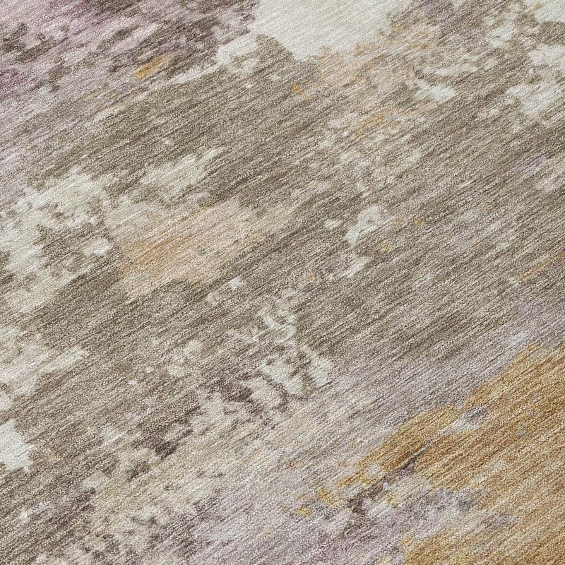 Washed abstract area rug surface in gray, taupe, brown, and muted purple flecks