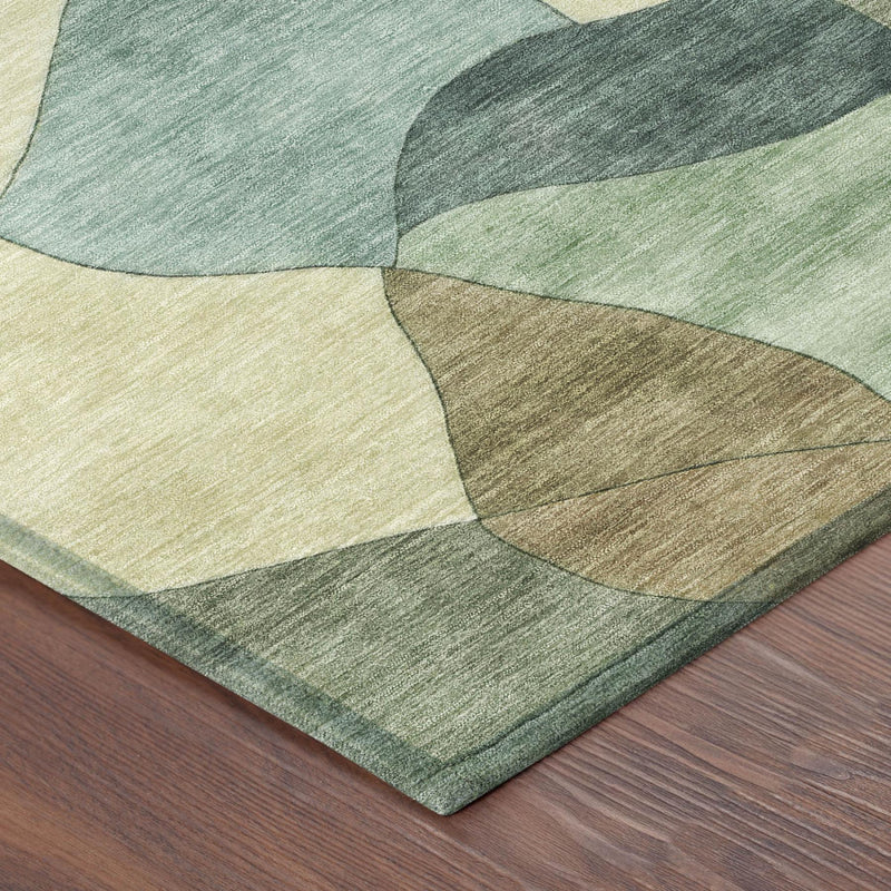 Rectangular rug corner with layered abstract green, beige, and tan patches