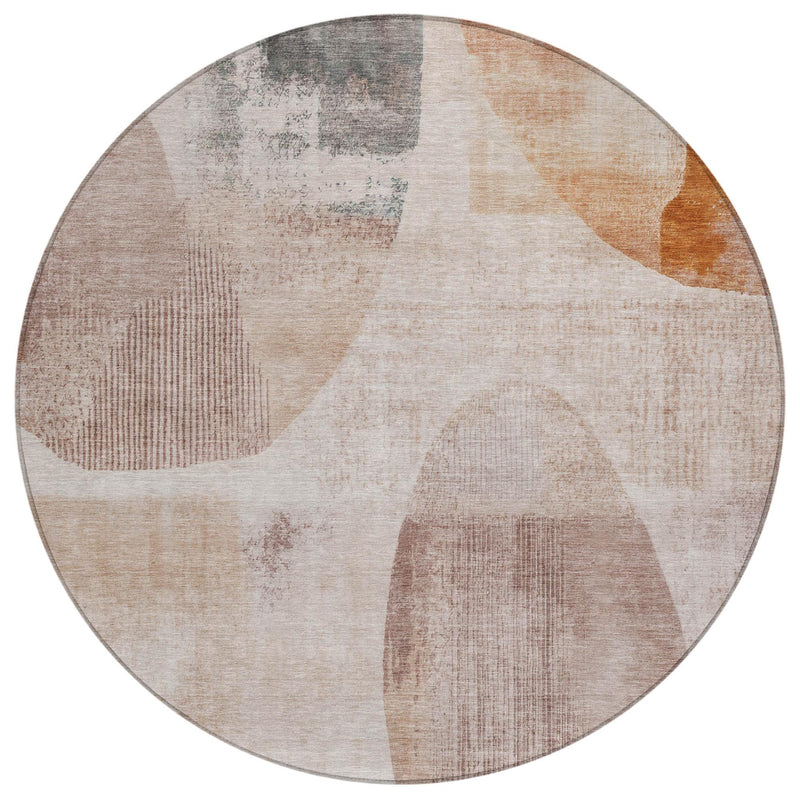 Round abstract geometric area rug in beige with copper, orange, and gray sections