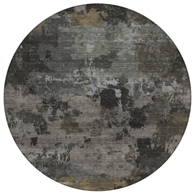 Round abstract area rug with mottled gray, pewter, and tan distressed pattern