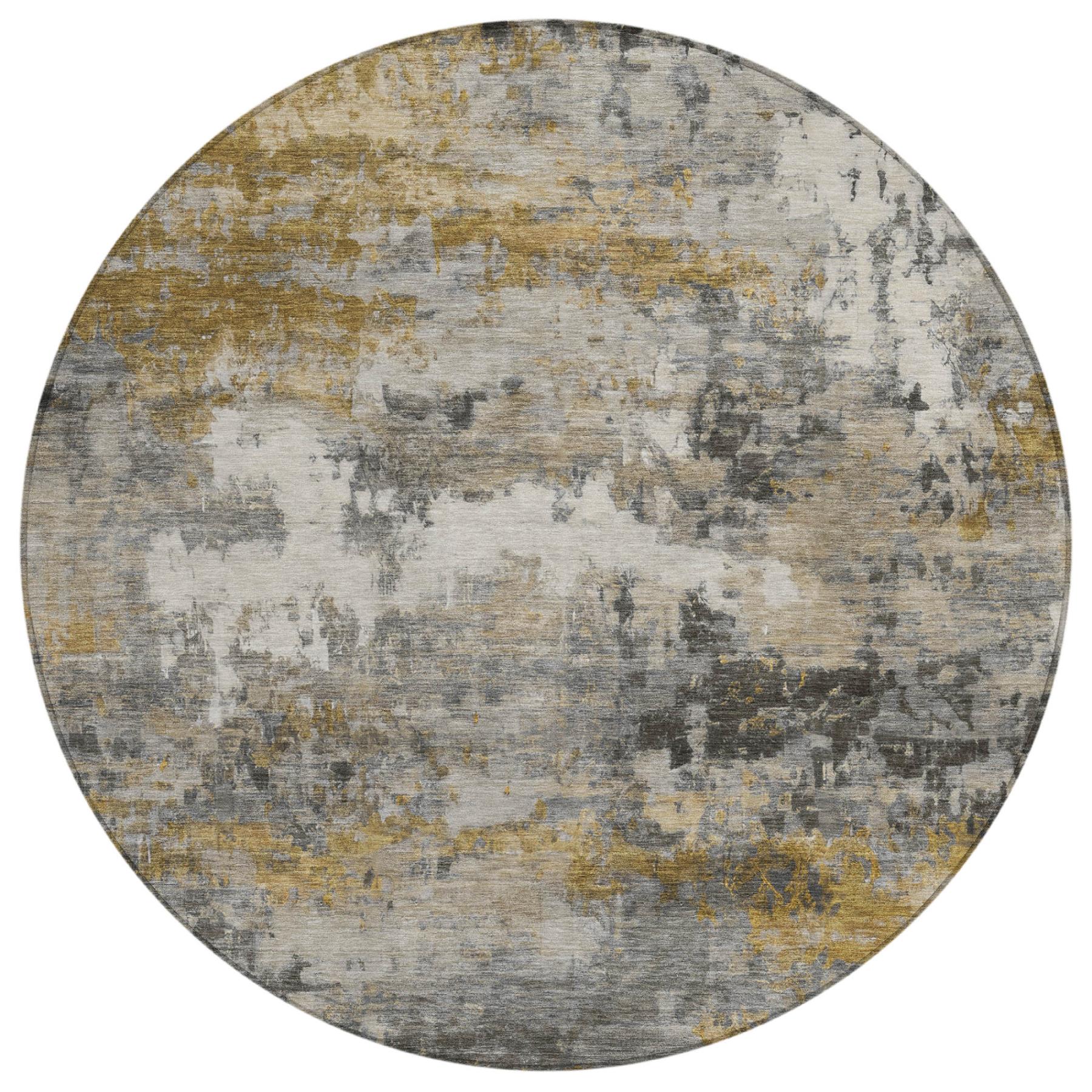 Round area rug in grey, gold, and beige, featuring a modern abstract design in soft, durable material.