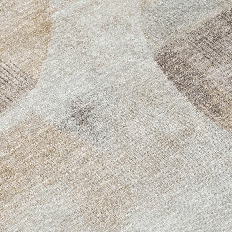 Ivory area rug close-up with textured silver, blue, and tan geometric pattern