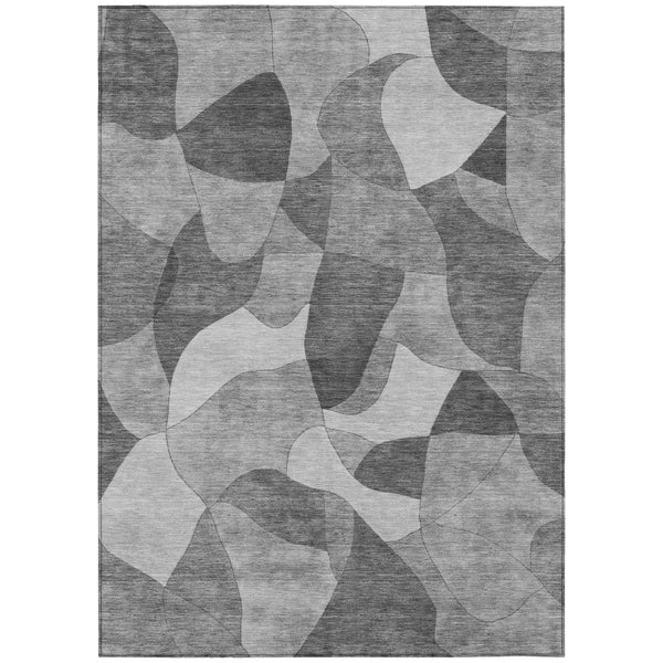 Gray and silver abstract area rug with layered irregular shapes