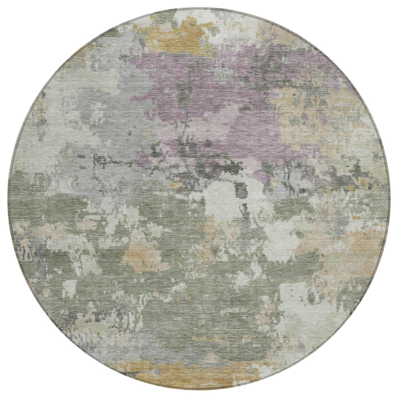 Round abstract rug with mottled sage green and cream, accented by muted lavender areas.