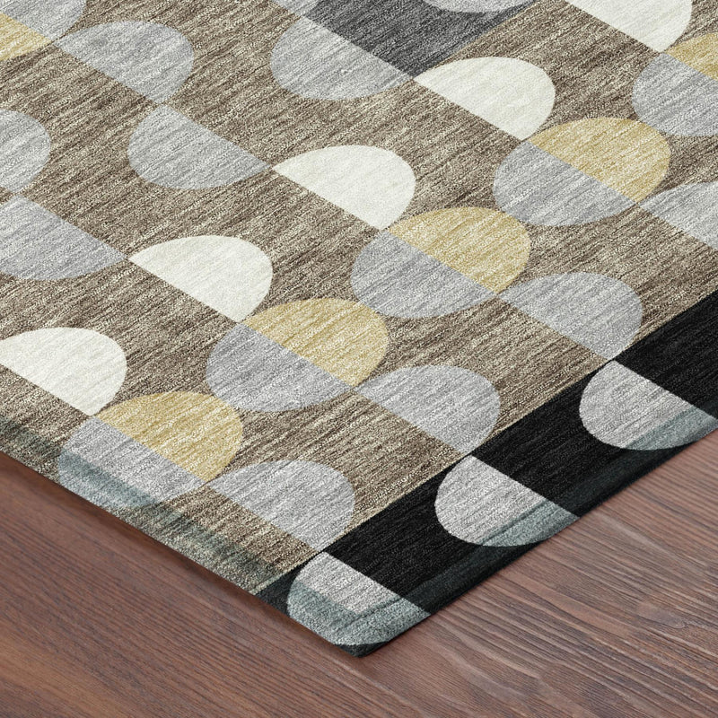 Corner view of round rug with black border and multicolor oval geometric pattern
