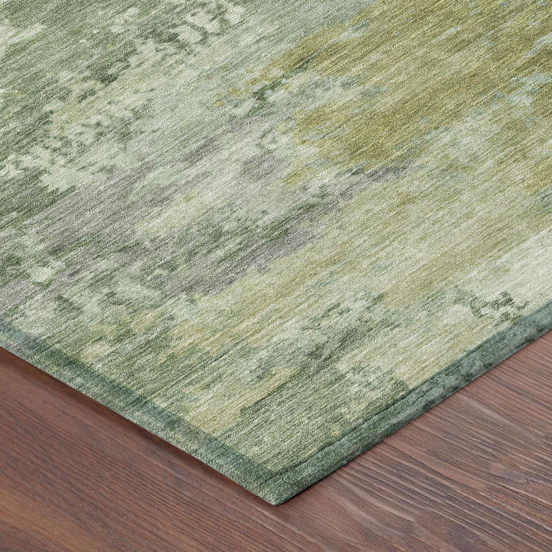 Edge corner of round green-and-beige abstract washable area rug with flat border