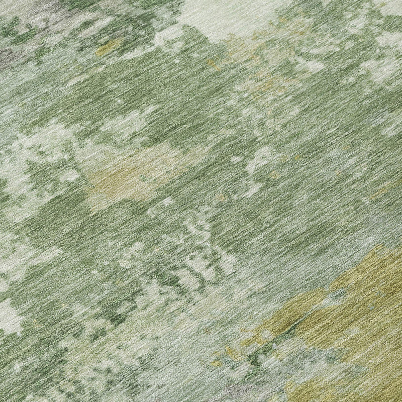 Abstract green and beige rug surface with distressed, mottled texture close-up