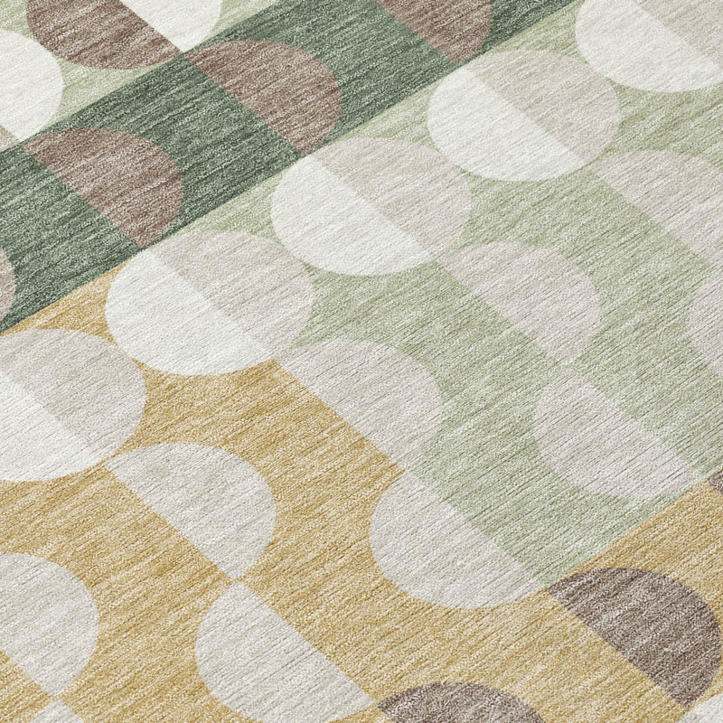 Geometric area rug with overlapping circles in green, tan, gray, and ivory