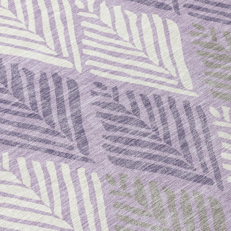 Lavender area rug with overlapping purple and cream geometric fan motifs