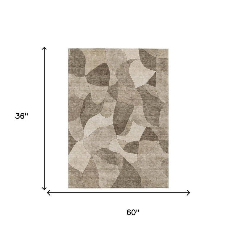 Beige and gray abstract area rug, 60 in x 36 in rectangle dimensions shown