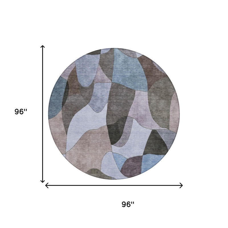 Round abstract area rug in blue and gray, 96 in diameter.