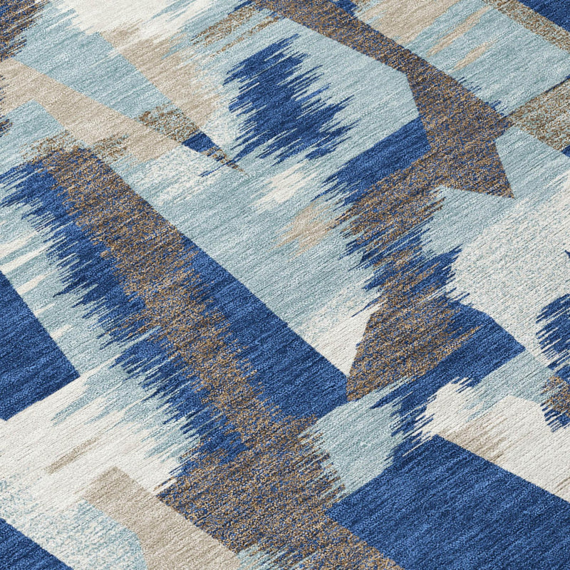 Blue and beige abstract area rug detail with large geometric blocks and distressed look
